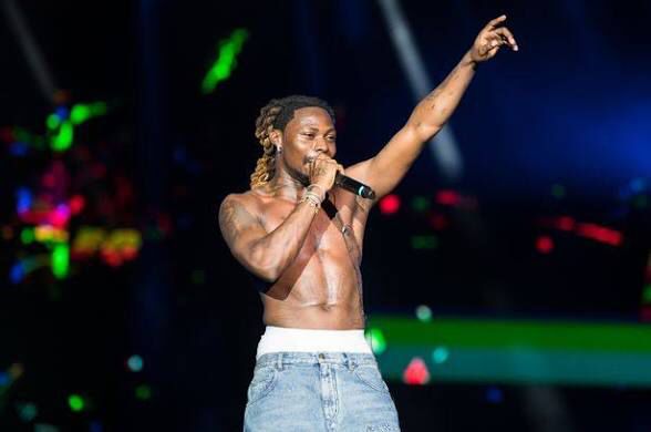 An image showing Nigeria musician popularly known as asake during is live concert