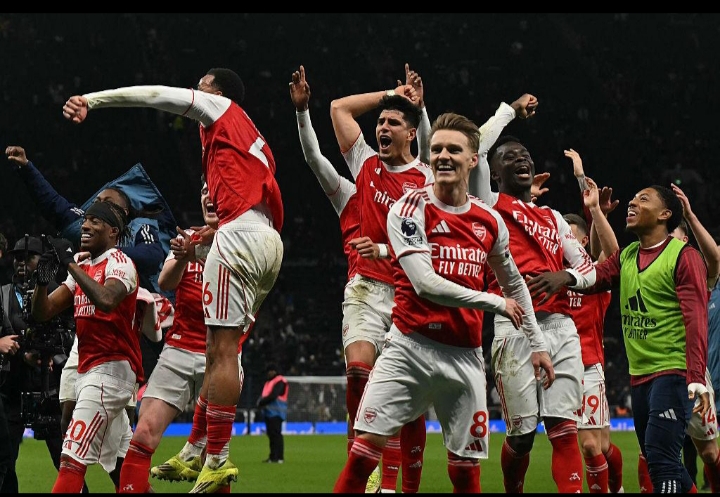 An image showing arsenal team members after winning the premier League 2026 cup