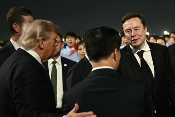An image showing Tesla CEO Elon musk during his visit with president trump to china